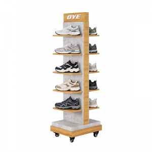 Freestanding shoe display tower with wood-look shelves, a branded header and caster wheels (5)