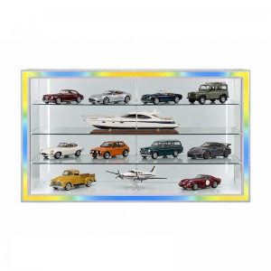 Model cars and larger scale models arranged with space around their bases inside a glass cabinet (1)